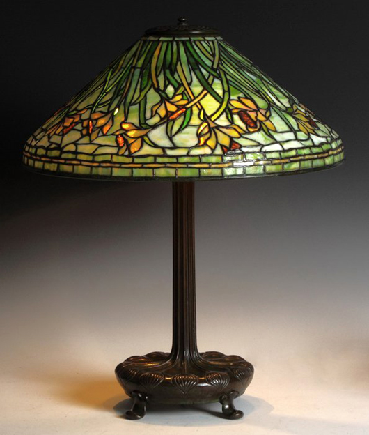 Tiffany Studios Daffodil lamp with base and shade both signed, 25 inches tall. Price realized: $57,000. Cottone Auctions image.